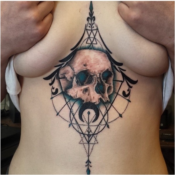 skull under breast tattoo