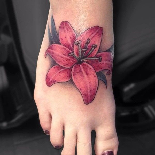 Tattoo on a Foot Featuring a Design of Tiger Lilies and Water Lilies