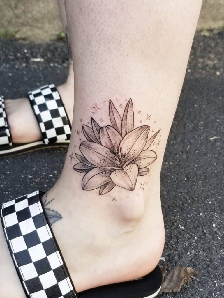 Leg Tattoo of a Flowering Water Lily Design