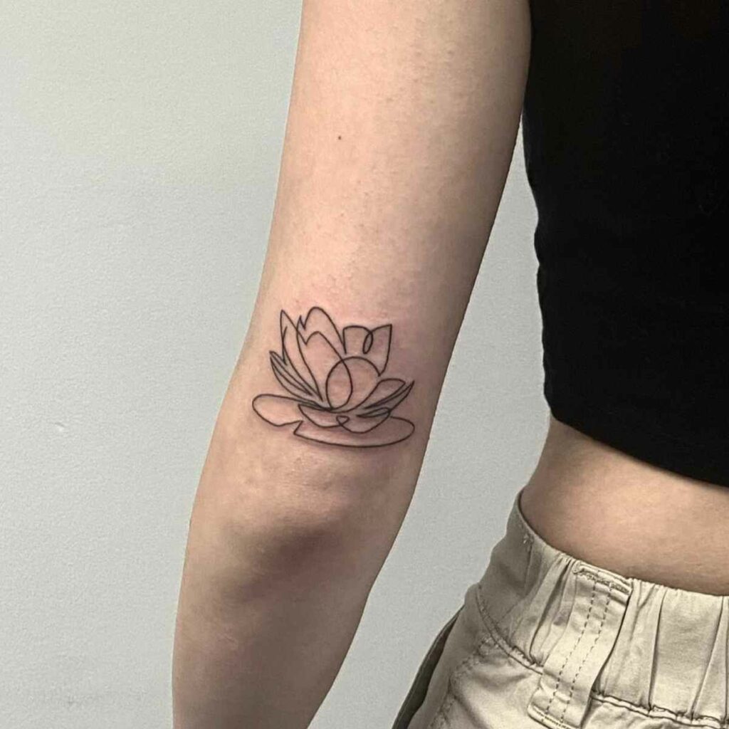 Tattoo of a Water Lily Design in Black and White on the Hand