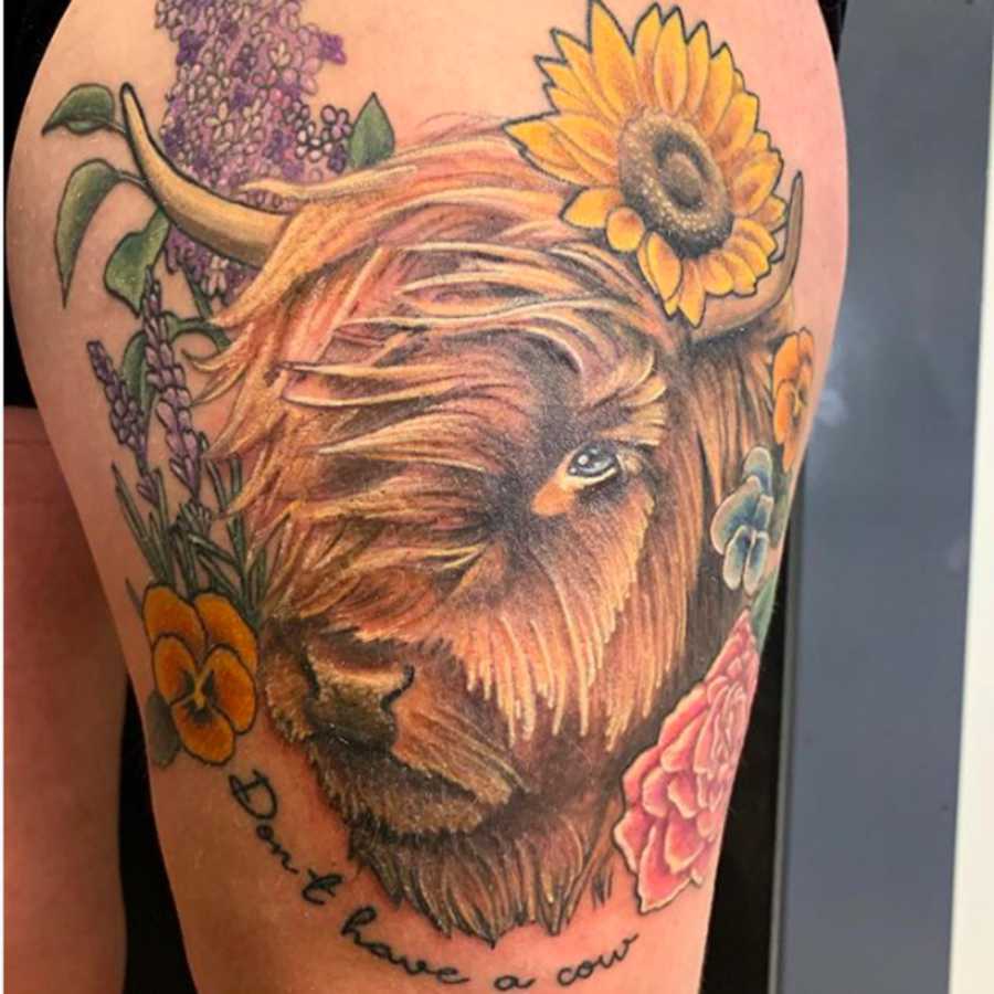 Tattoo of a Cow and a Sunflower