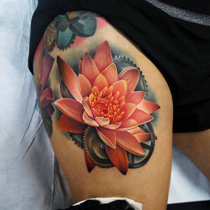 Thigh-Scanning Water Lily Tattoo with Deep Meaning